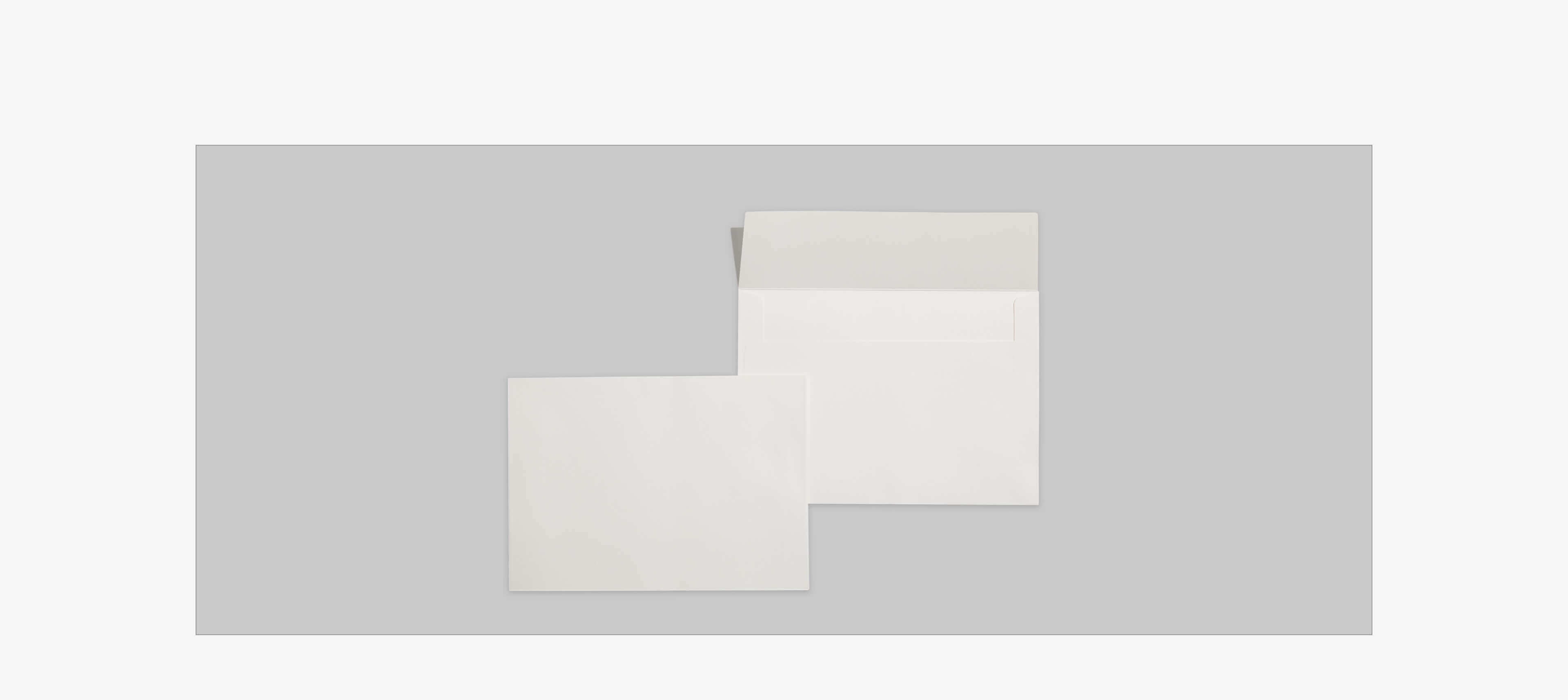 two envelopes on a grey table