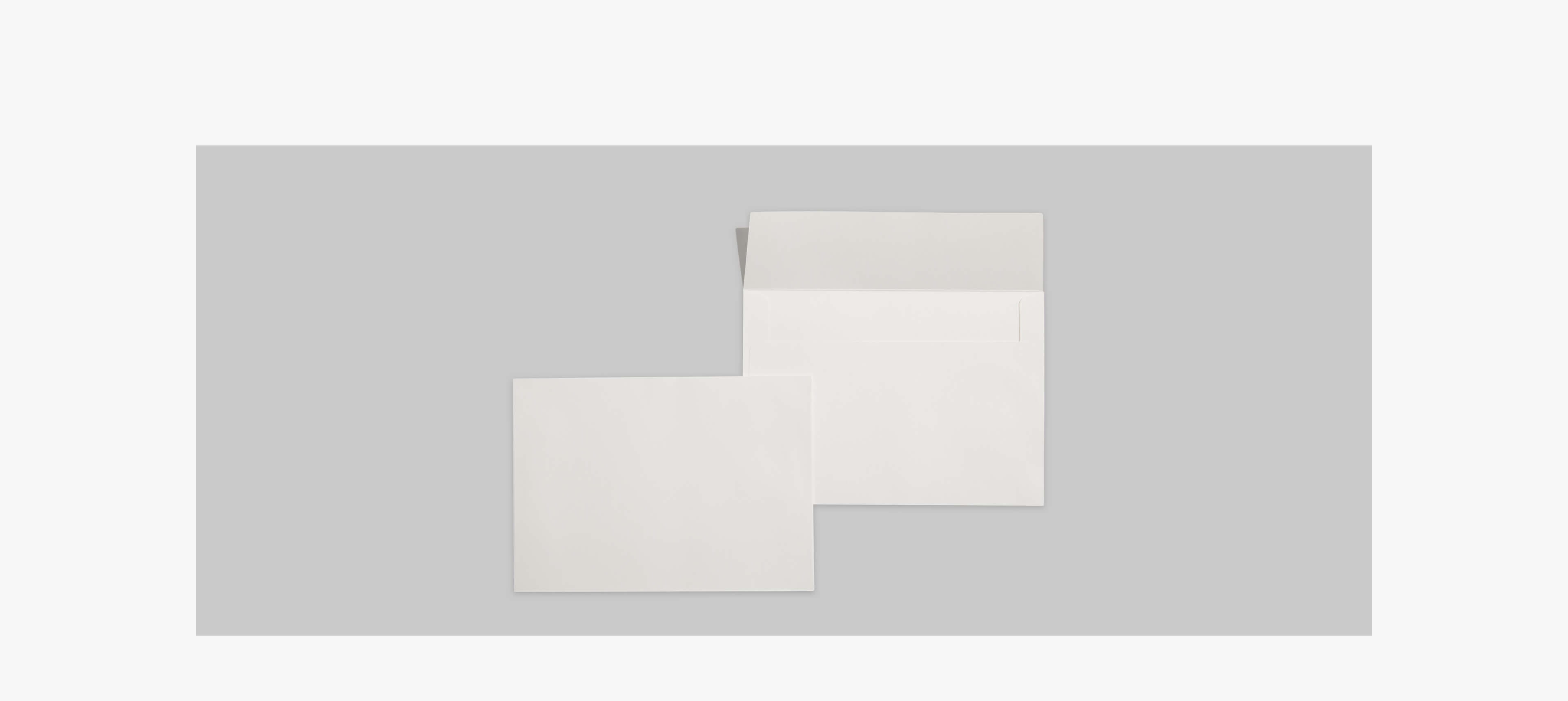 two envelopes on a grey table