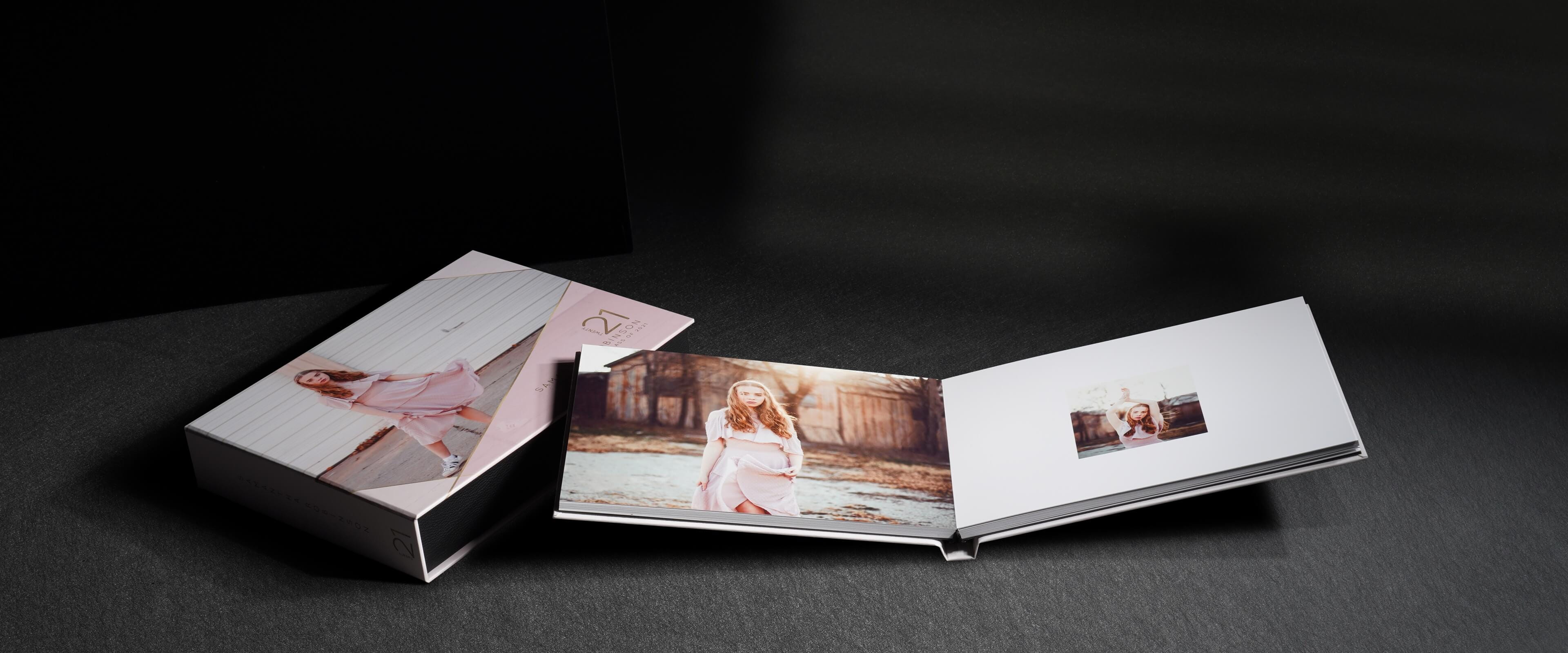 an image box album set showing a photo album opened resting on a printed box