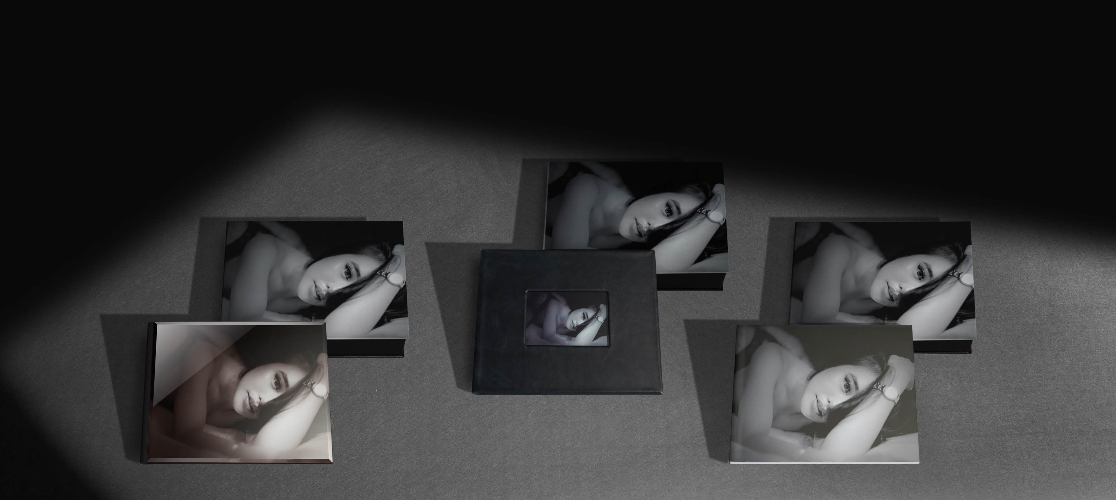 three image boxes with album leaning against them showing woman in lingerie