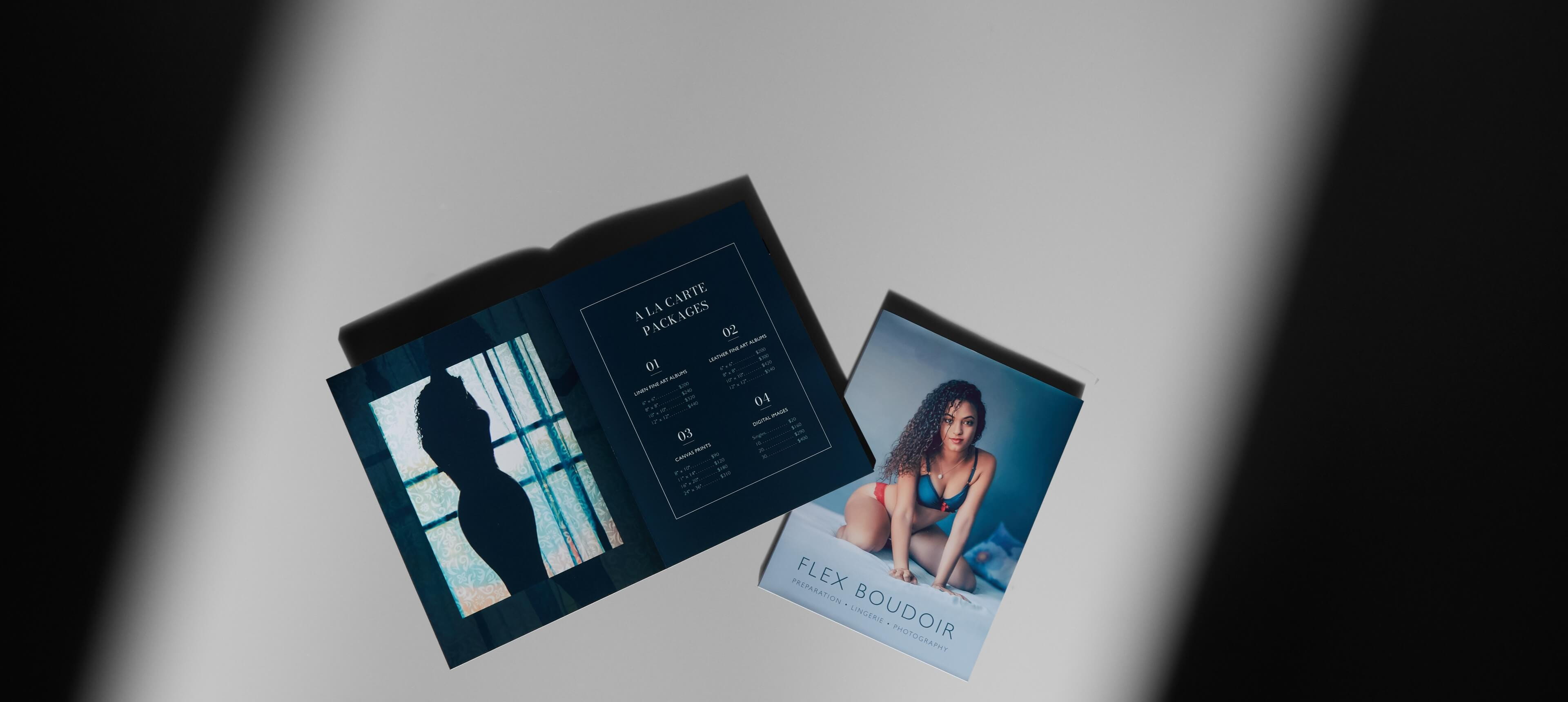 two layflat booklets on a white table showing a woman in lingerie