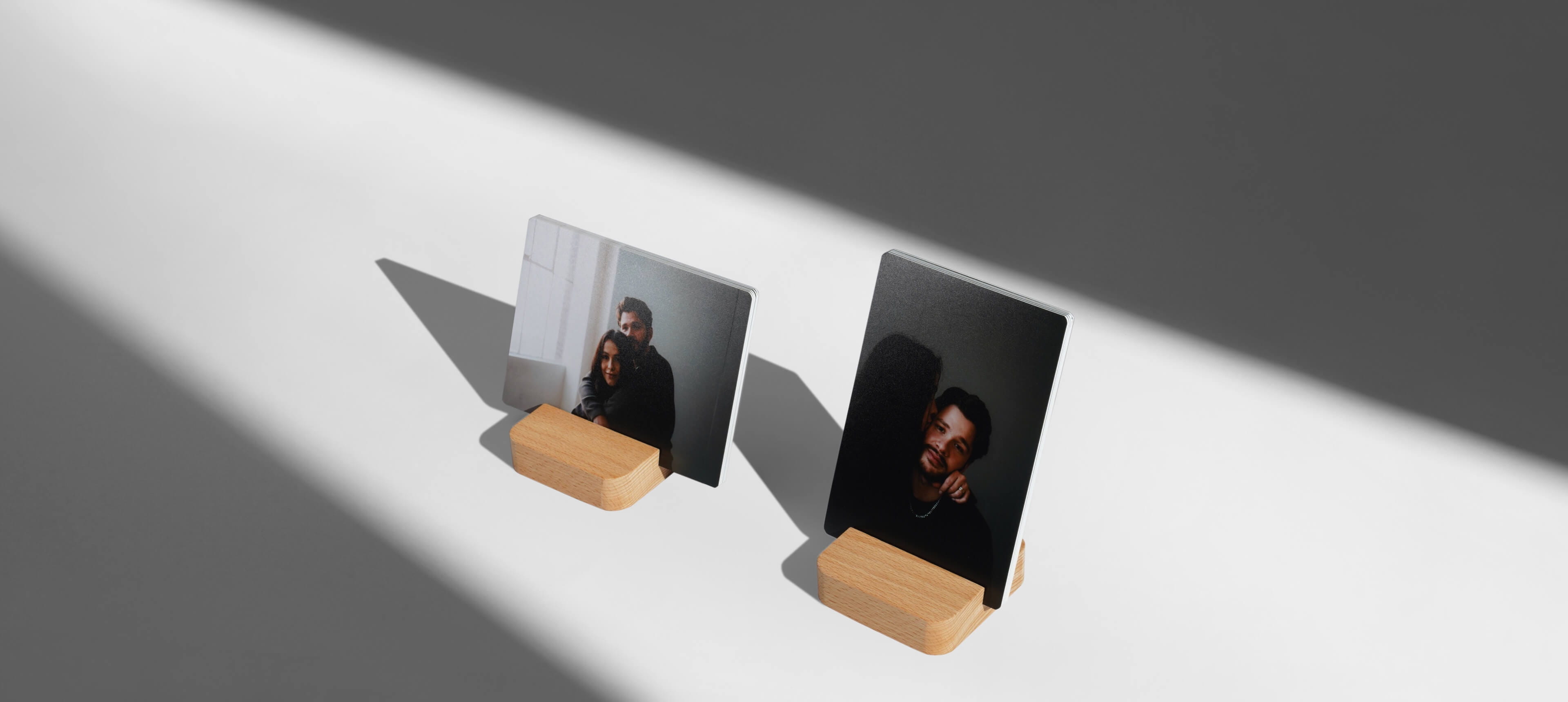 two little prints stands on white table in different orientation showing a couple close to each other