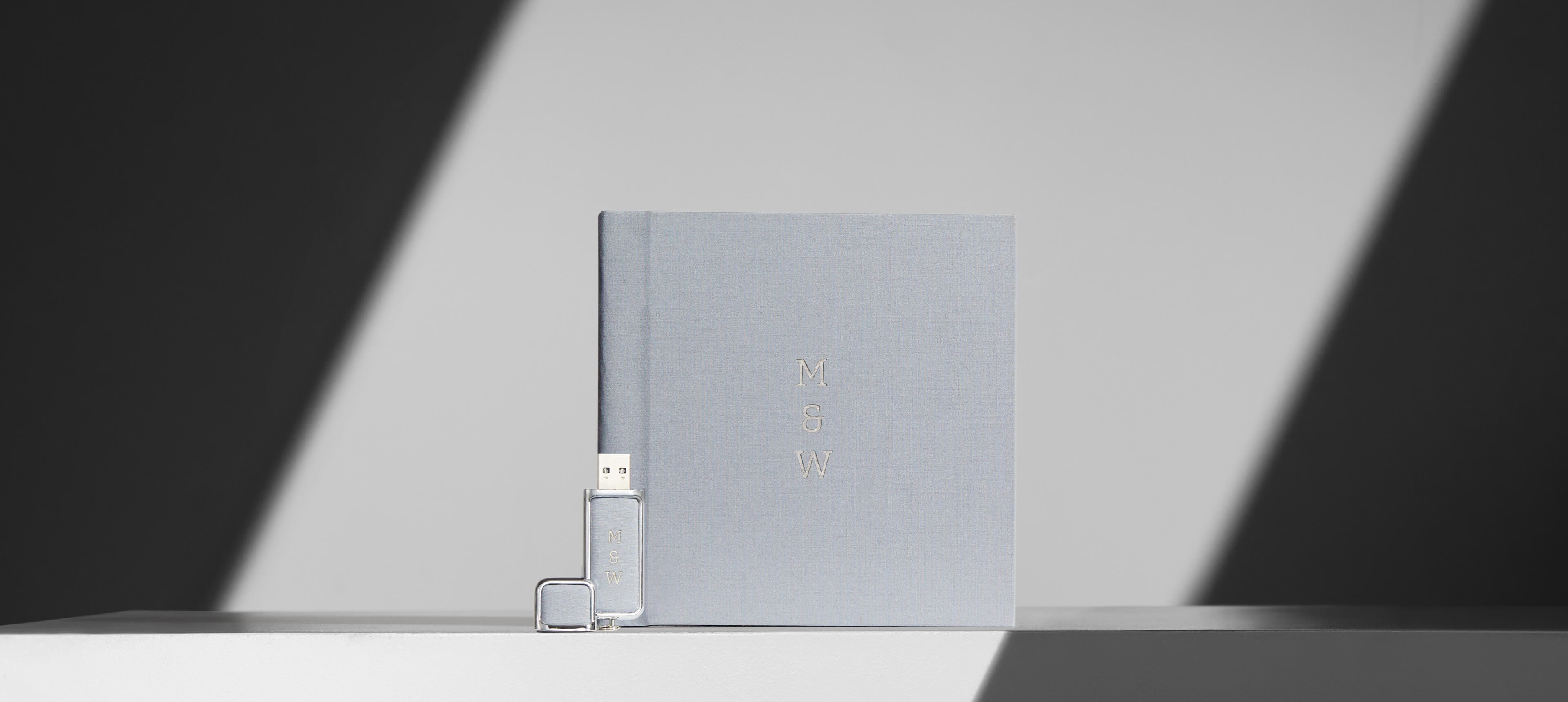 custom usb drive in grey linen with engraving and linen photo album