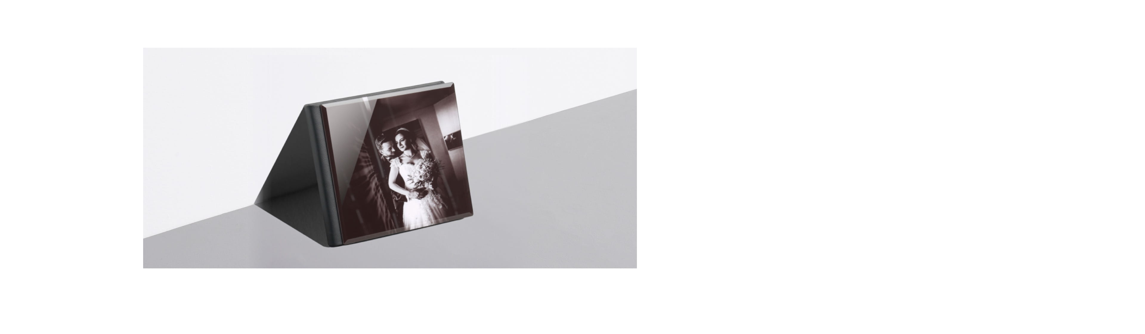 wedding album leaning against a wall with a bride and groom on cover