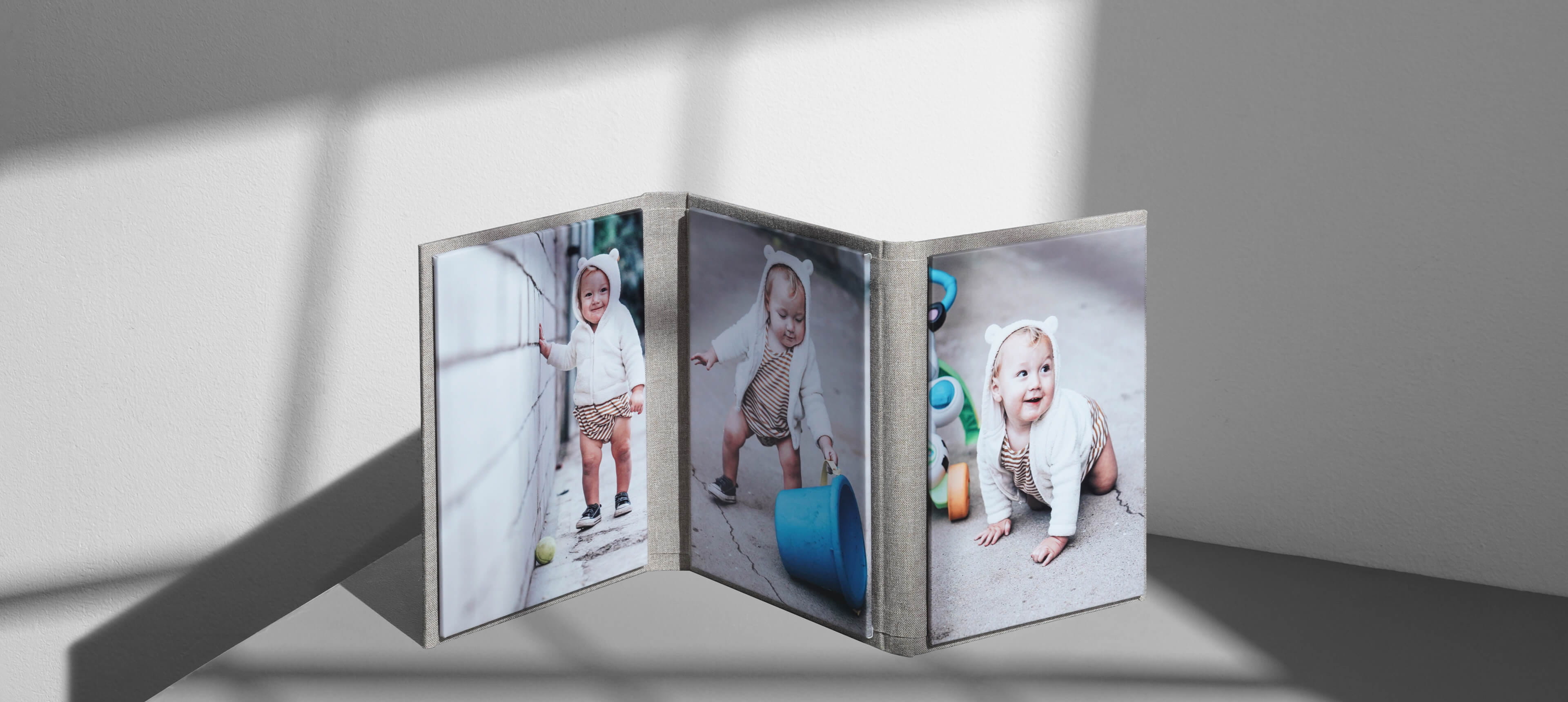 wrapped image folio with three panels showing baby