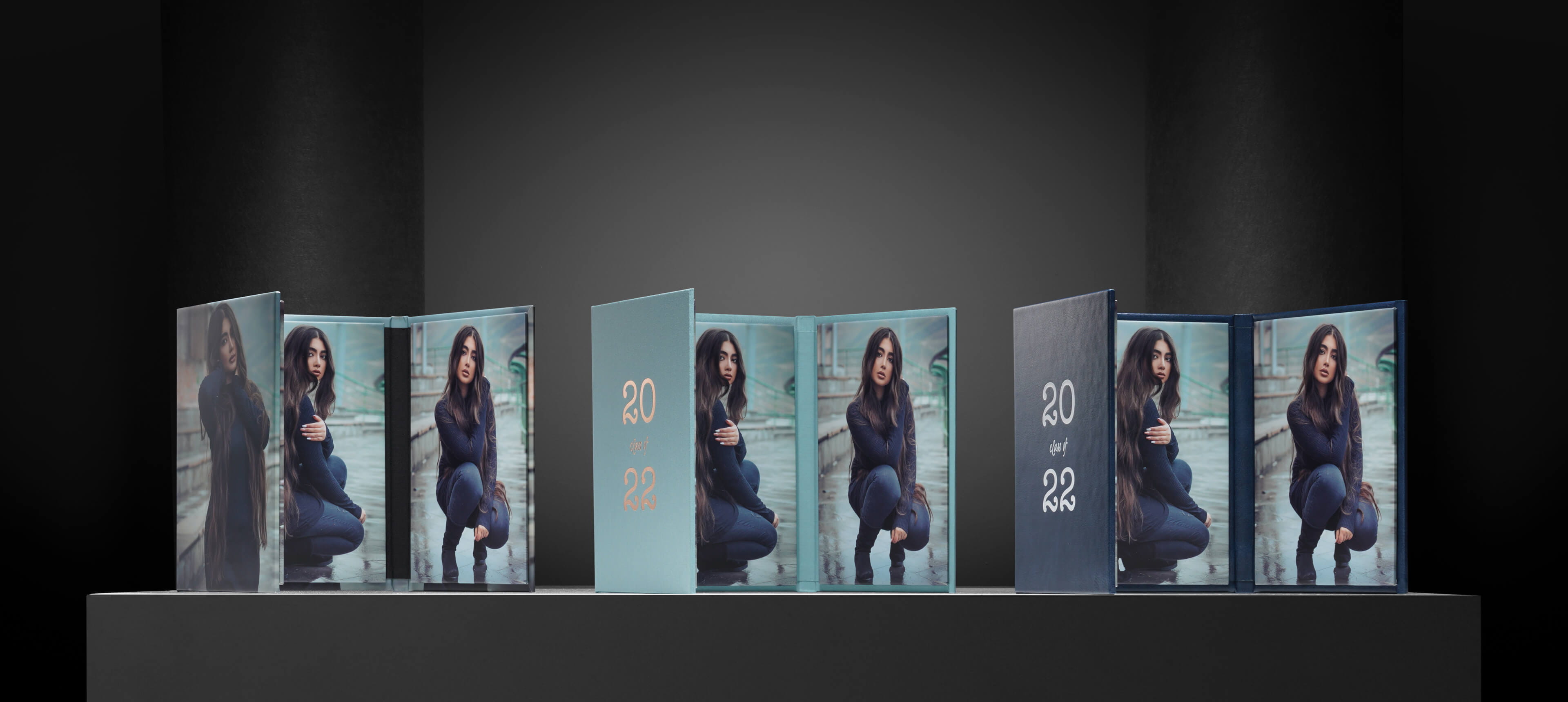 three wrapped image folios with a girl in blue sweater and jeans